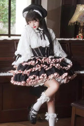 Schwarzes/rosa ärmelloses Lolita-Kleid mit mehrlagigen Rüschen, Schleife und Schnürung